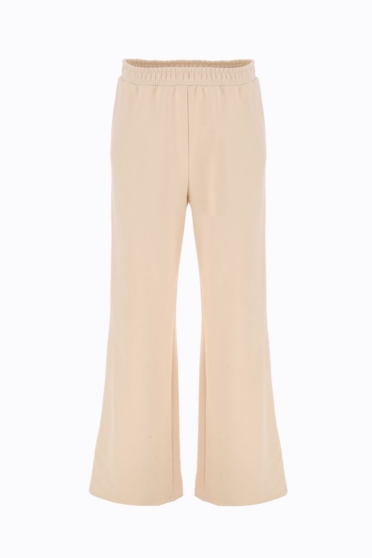 Pantaloni flare monocolour con vita alta elasticizzata